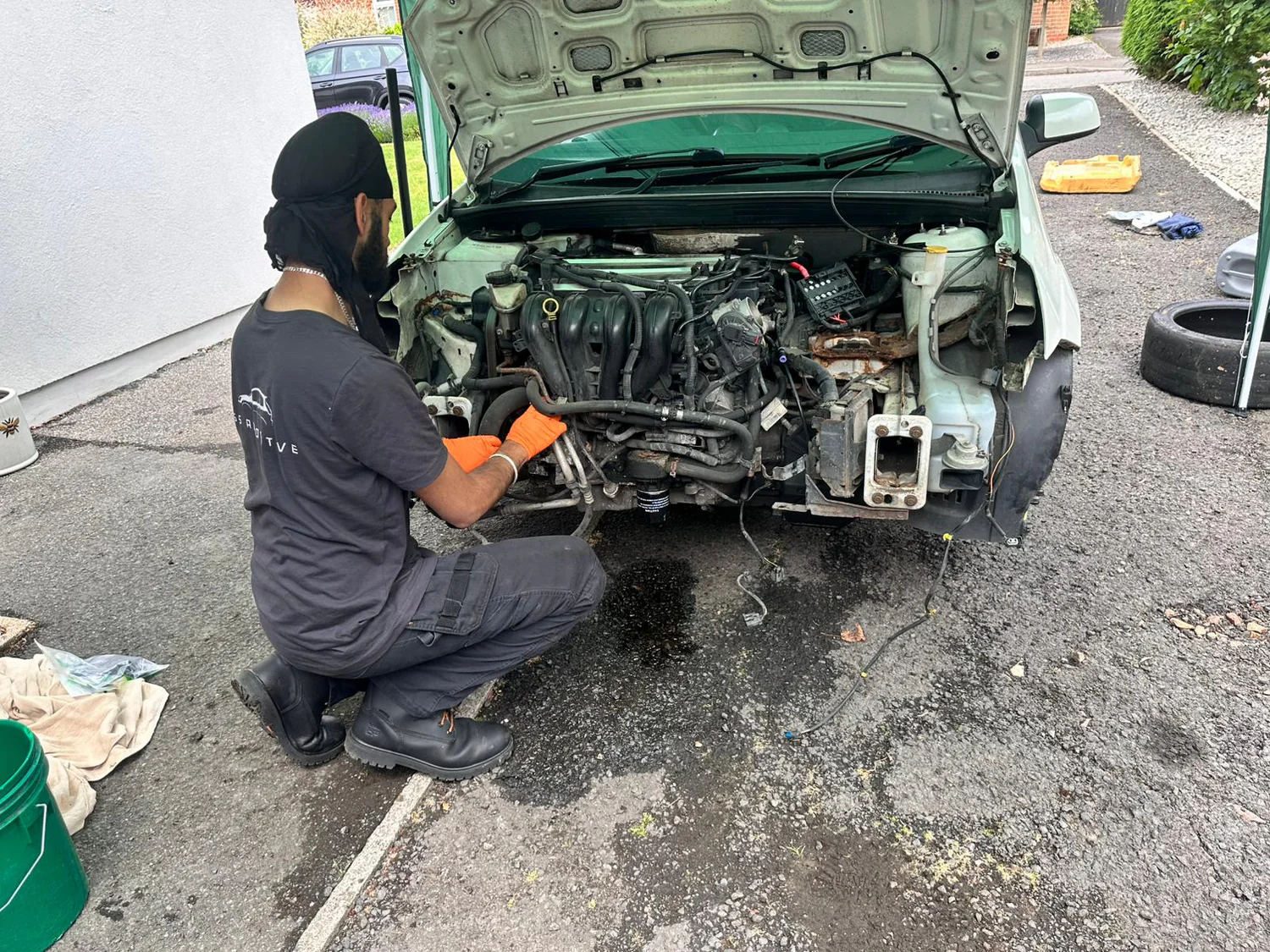 Jaspal, JSS Automotive owner-technician, working on a customer's Ford
